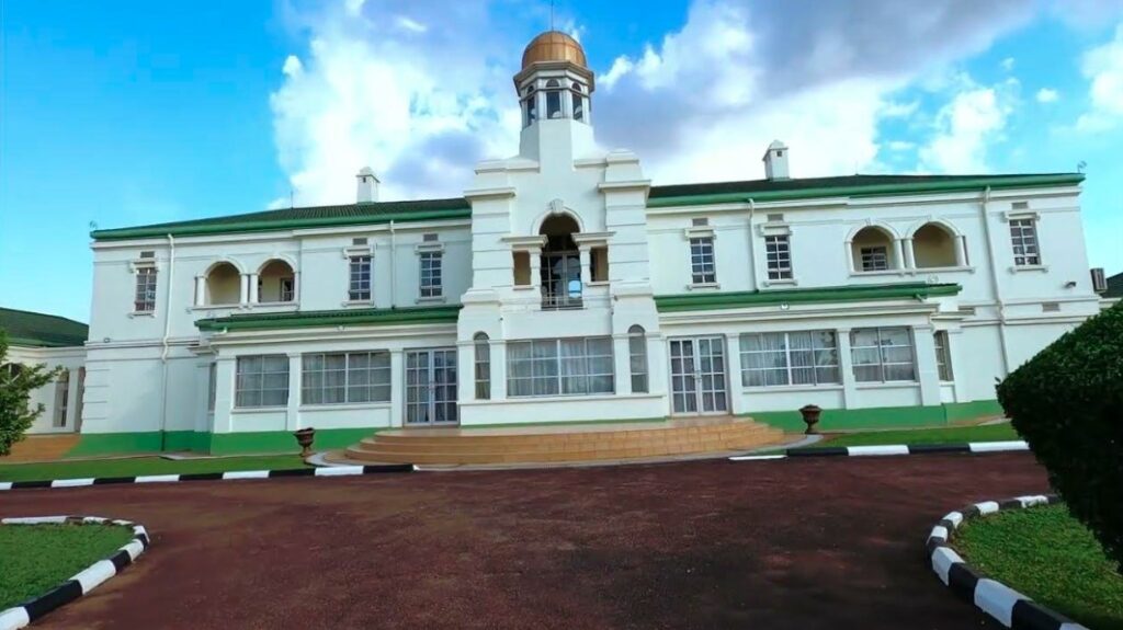 The iconic Wankaci entrance leading to Kabaka Palace Mengo Lubiri, featuring traditional architecture.