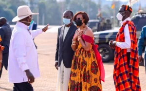 President Yoweri Museveni walking past Dr. Lilly Ajarova, giving her a thumbs up as she assumes her new role as Senior Presidential Advisor on Tourism.