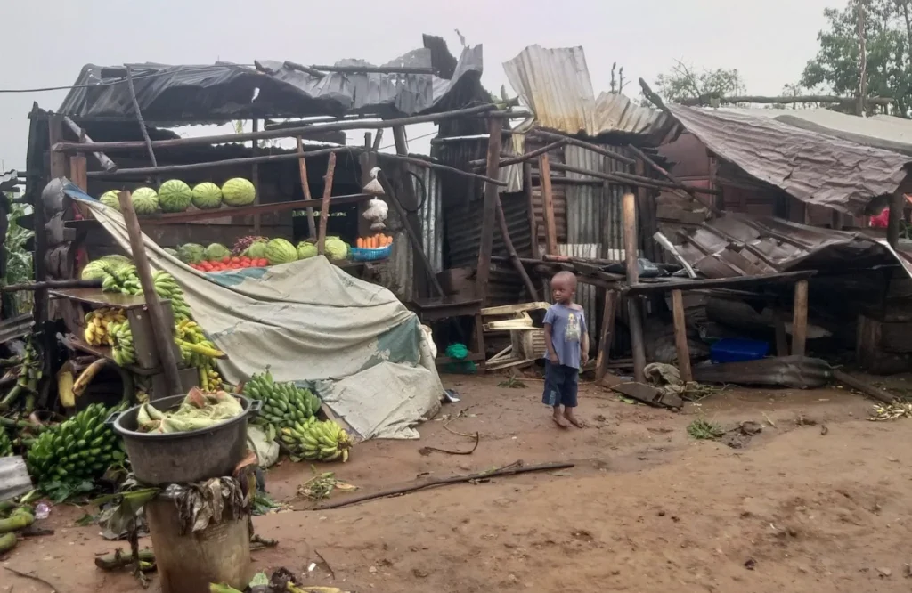 Collapsed roofs and debris from destroyed homes in Kalangala after the cyclone