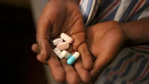 A patient receiving free ARVs at a public health facility in Uganda.