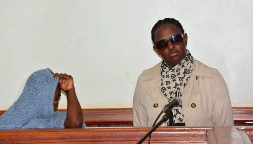 Jolin Kanohere Rugari, with her housemaid, Robinah Nabbanja, at Nakawa Magistrates Court
