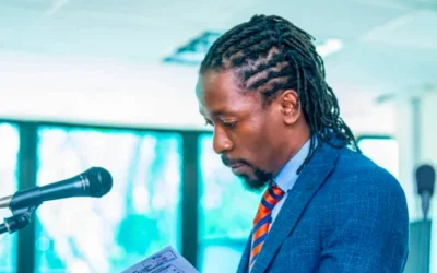 Isaac Ssemakadde speaking at a legal symposium prior to arrest warrant